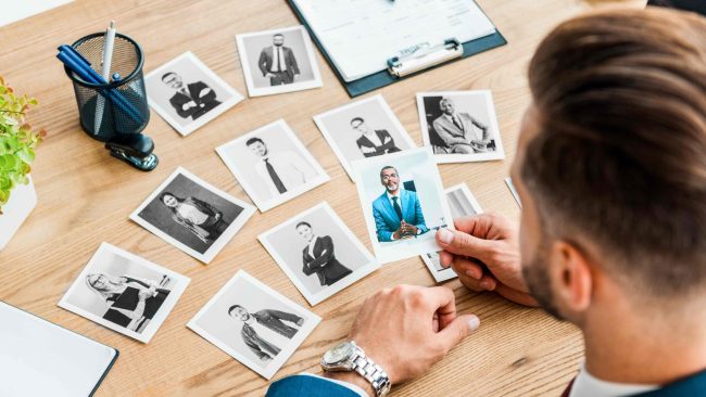 selective-focus-of-recruiter-holding-photo-of-afri-2023-11-27-05-30-33-utc