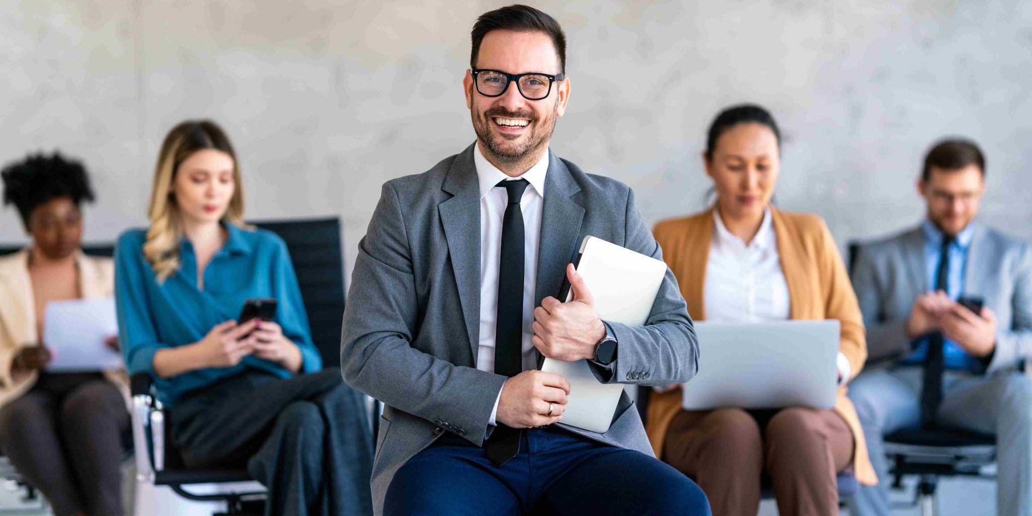 professionals-waiting-for-interviews-holding-devic-2026-03-25-05-05-24-utc how to find great candidates
